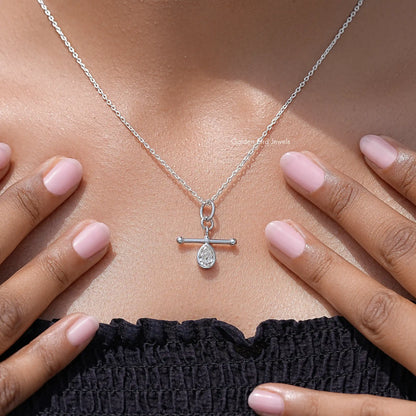 Silver pendant necklace on chain with teardrop pear-cut stone in bezel setting