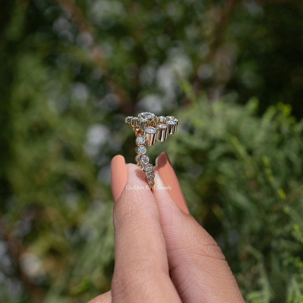 10k yellow gold moissanite ring with round halo spiral stones, side view