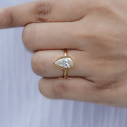 Detailed view of Bezel Set Pear Diamond Solitaire Ring