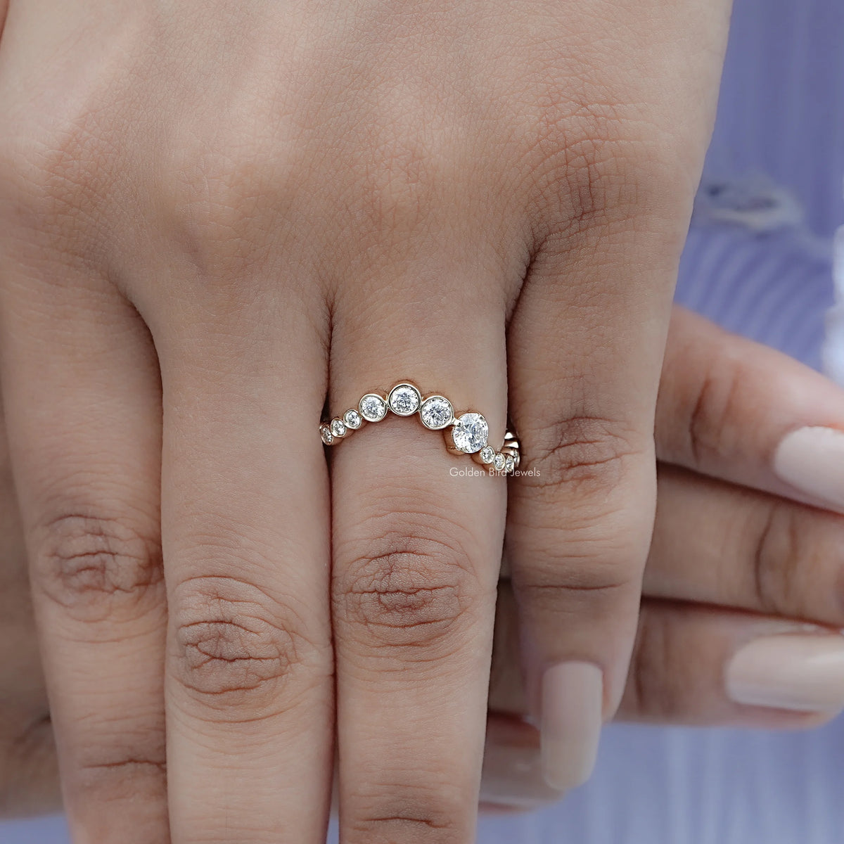 Silver curved full eternity ring with evenly spaced round moissanite-style stones