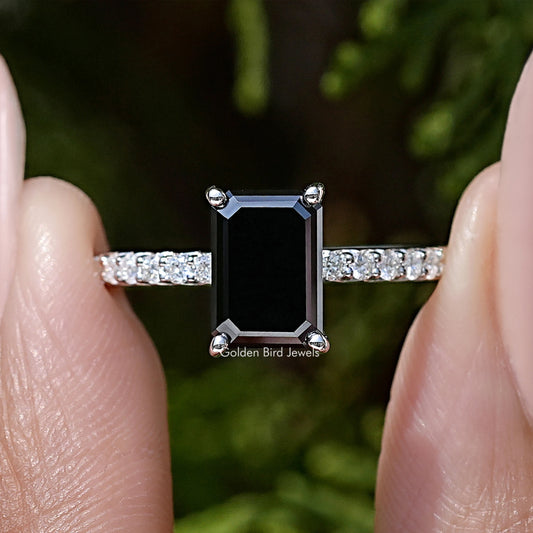 Moissanite accent ring with black emerald-cut center stone and pavé silver band