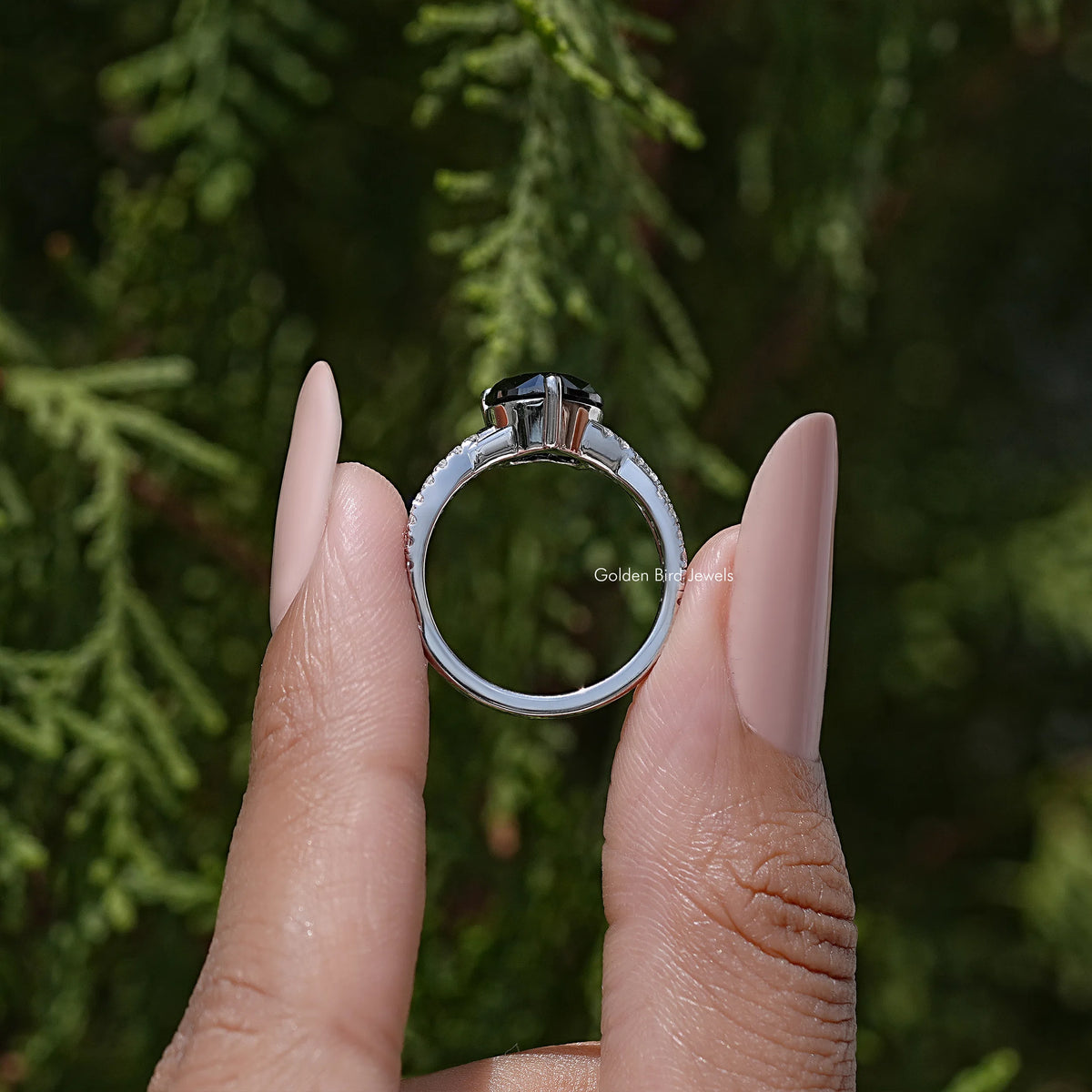 Sterling silver ring with black heart moissanite and twisted accent setting