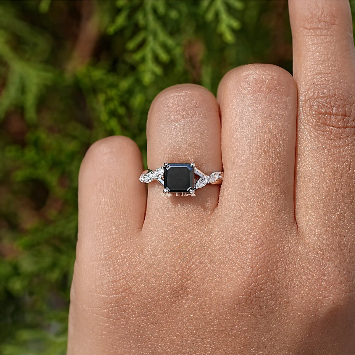 Asscher-cut black center moissanite ring with halo and prong-set side stones