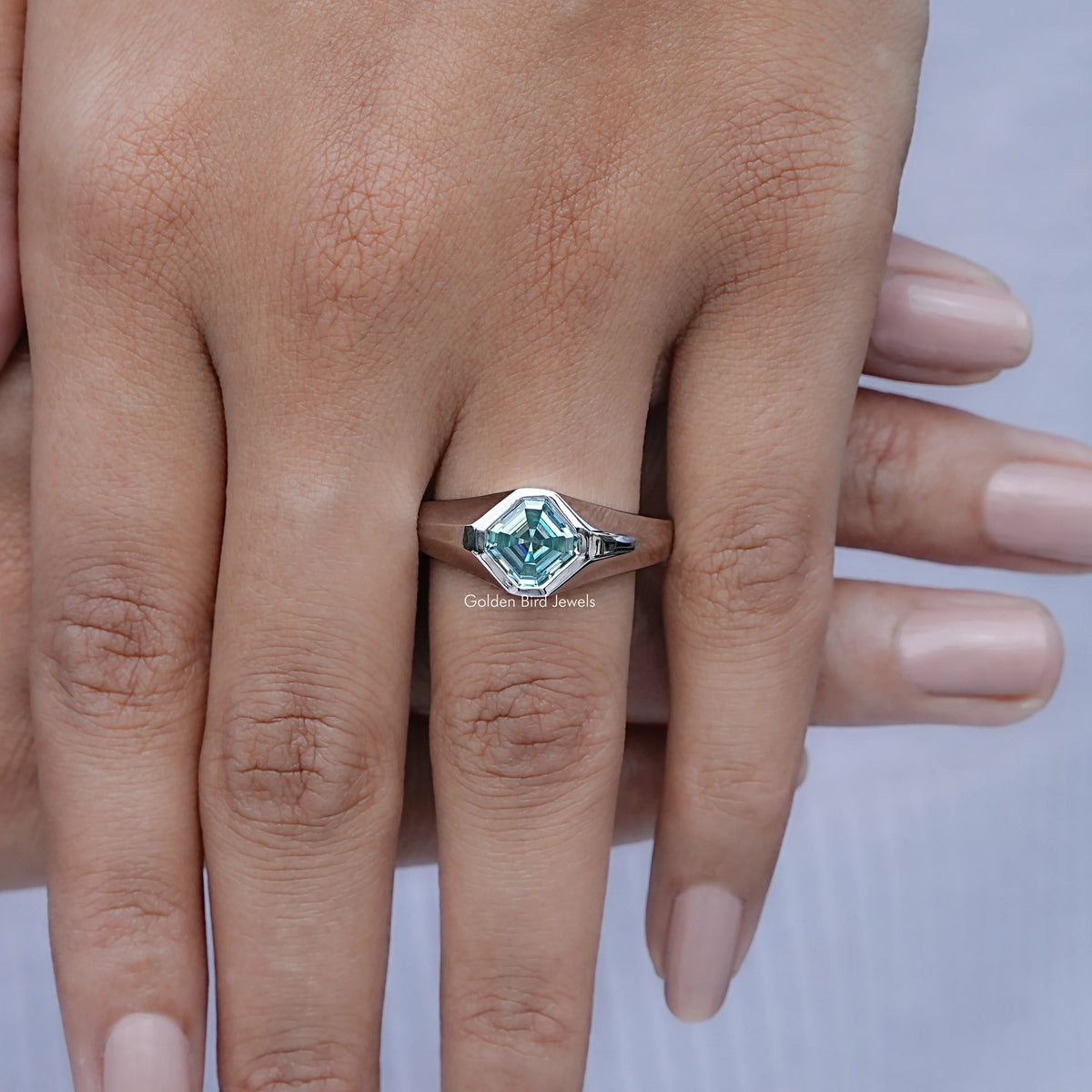 In finger front view of Asscher Moissanite Solitaire Engagement Ring in unique shape