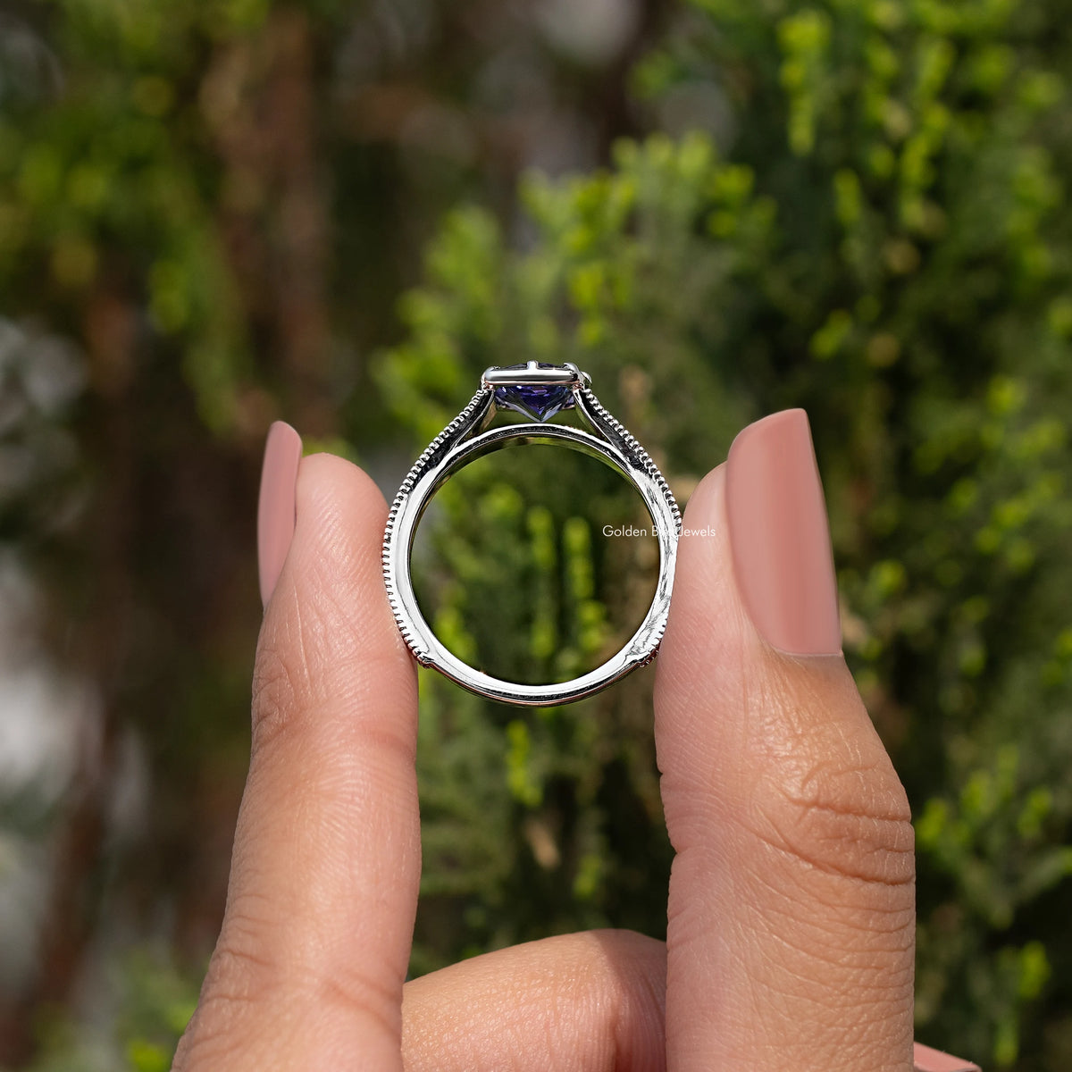 Tanzanite cushion-cut accent ring in silver, side view