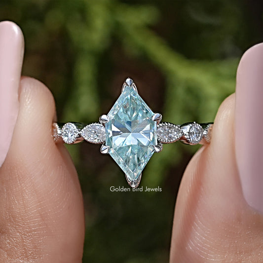 Sterling silver moissanite engagement ring with blue marquise center and side diamonds