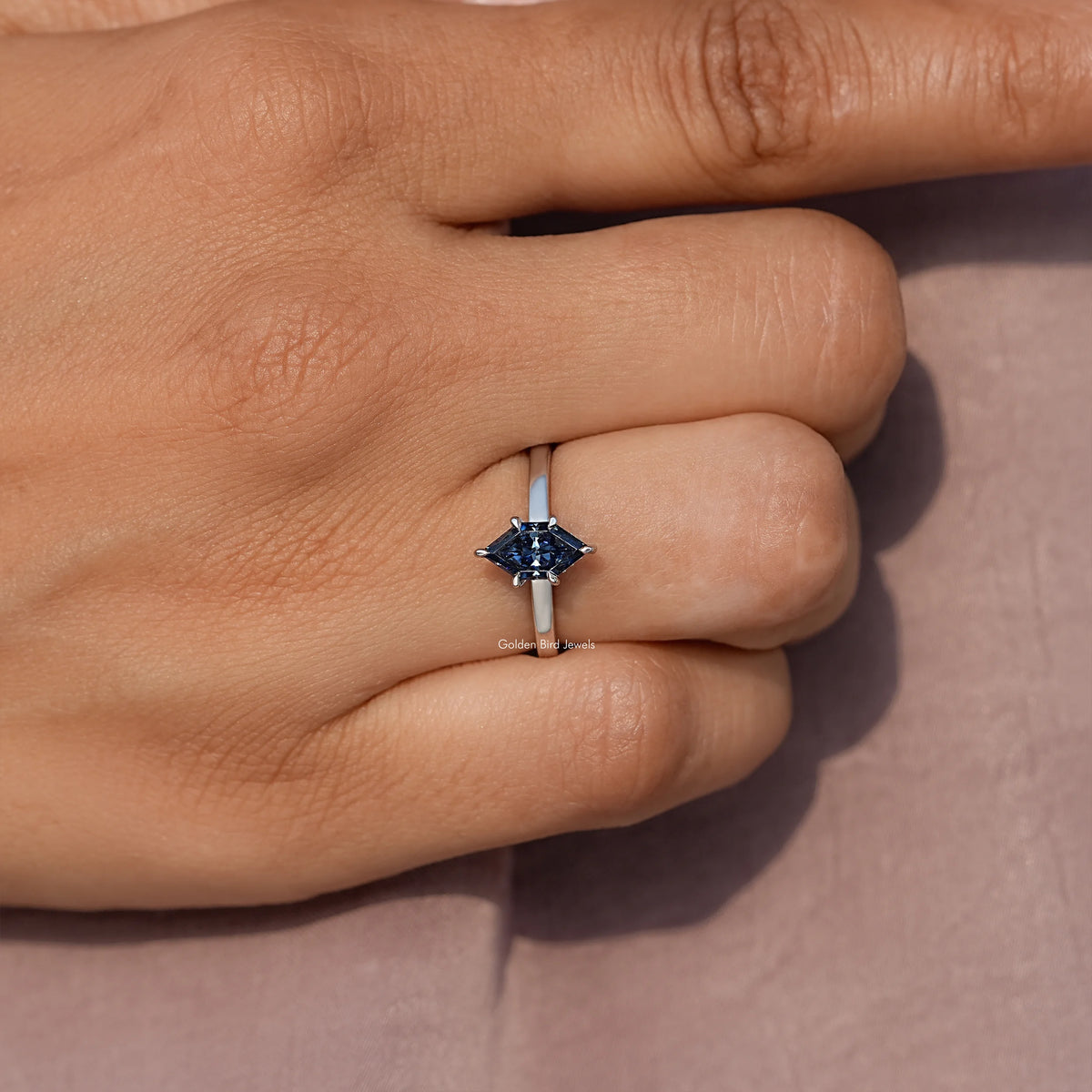 Prong-set blue marquise-cut moissanite ring on silver band