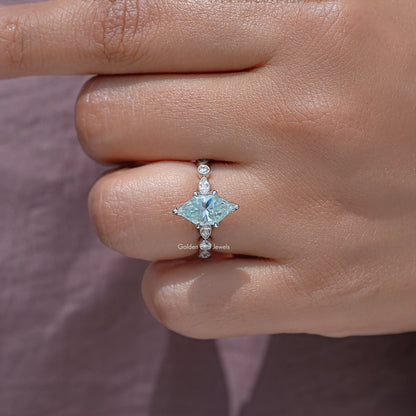 Sterling silver moissanite engagement ring close-up with blue marquise center and side studs