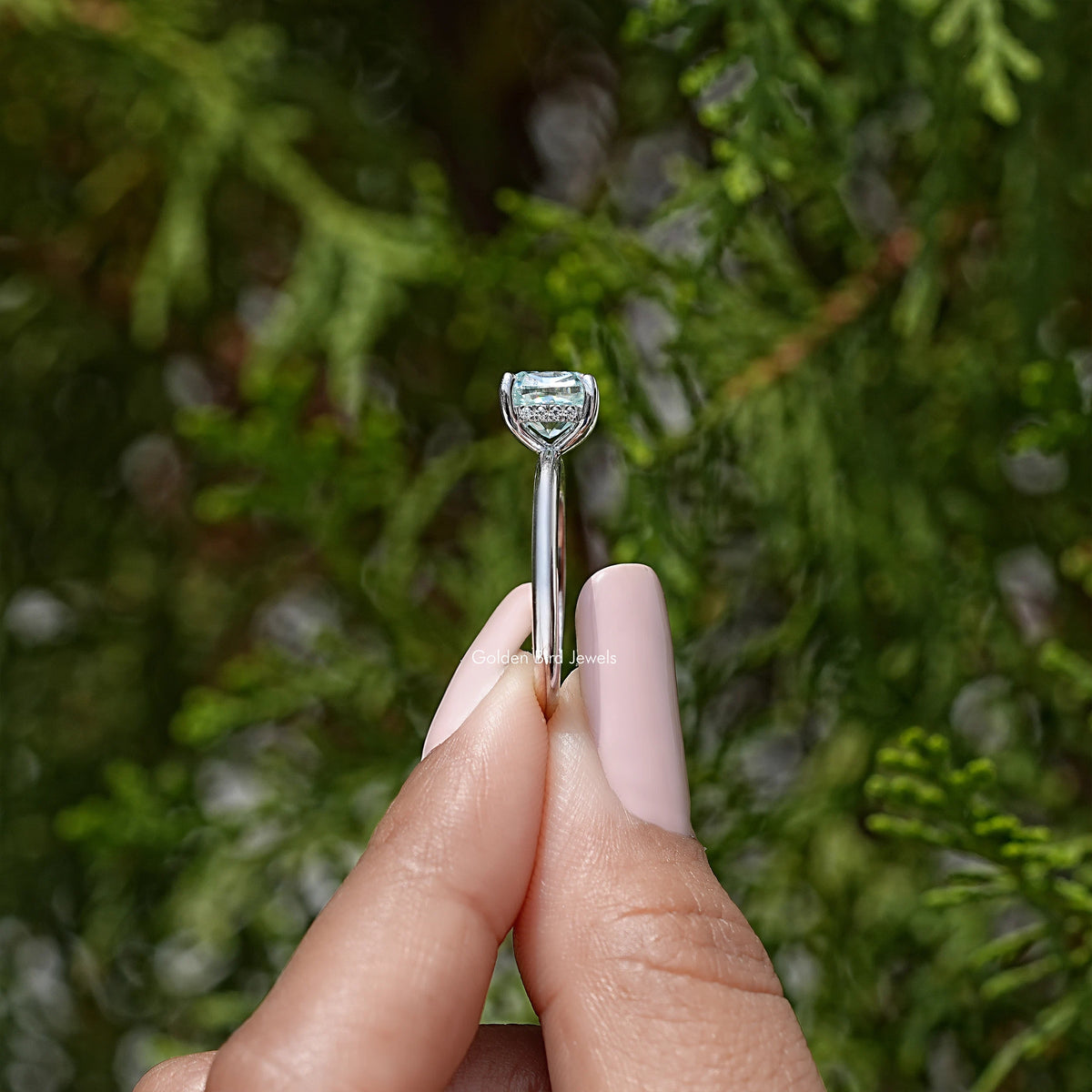 Sterling silver cushion-cut moissanite solitaire ring, upright view of band and prongs
