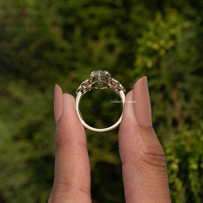 Blue moissanite oval ring with side marquise stones, prong-set in white metal