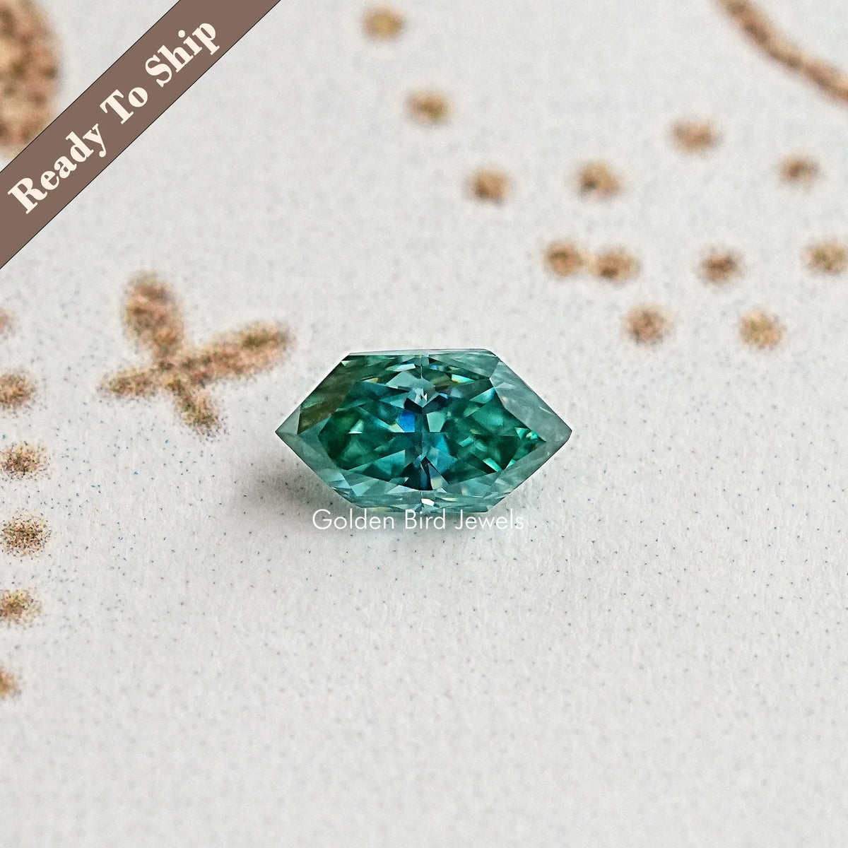 Marquise-cut blue-green moissanite gemstone, angled view of teal facets