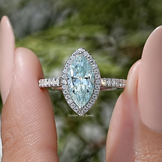 Blue marquise-cut moissanite ring with pavé band