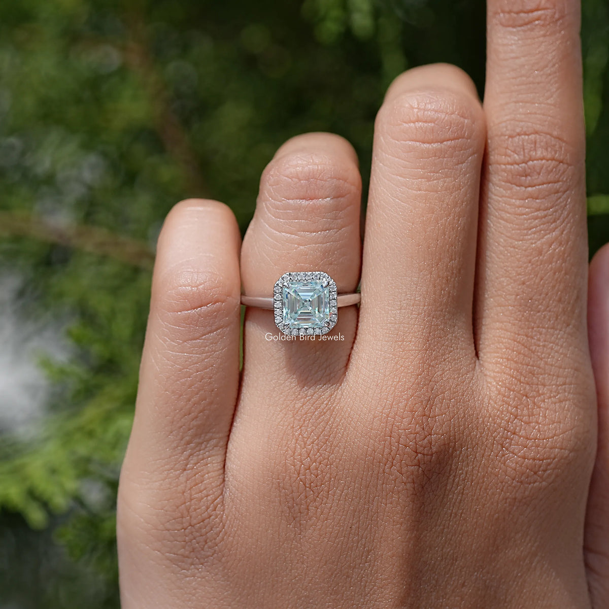 Asscher cut moissanite halo wedding ring on hand, 925 sterling silver band