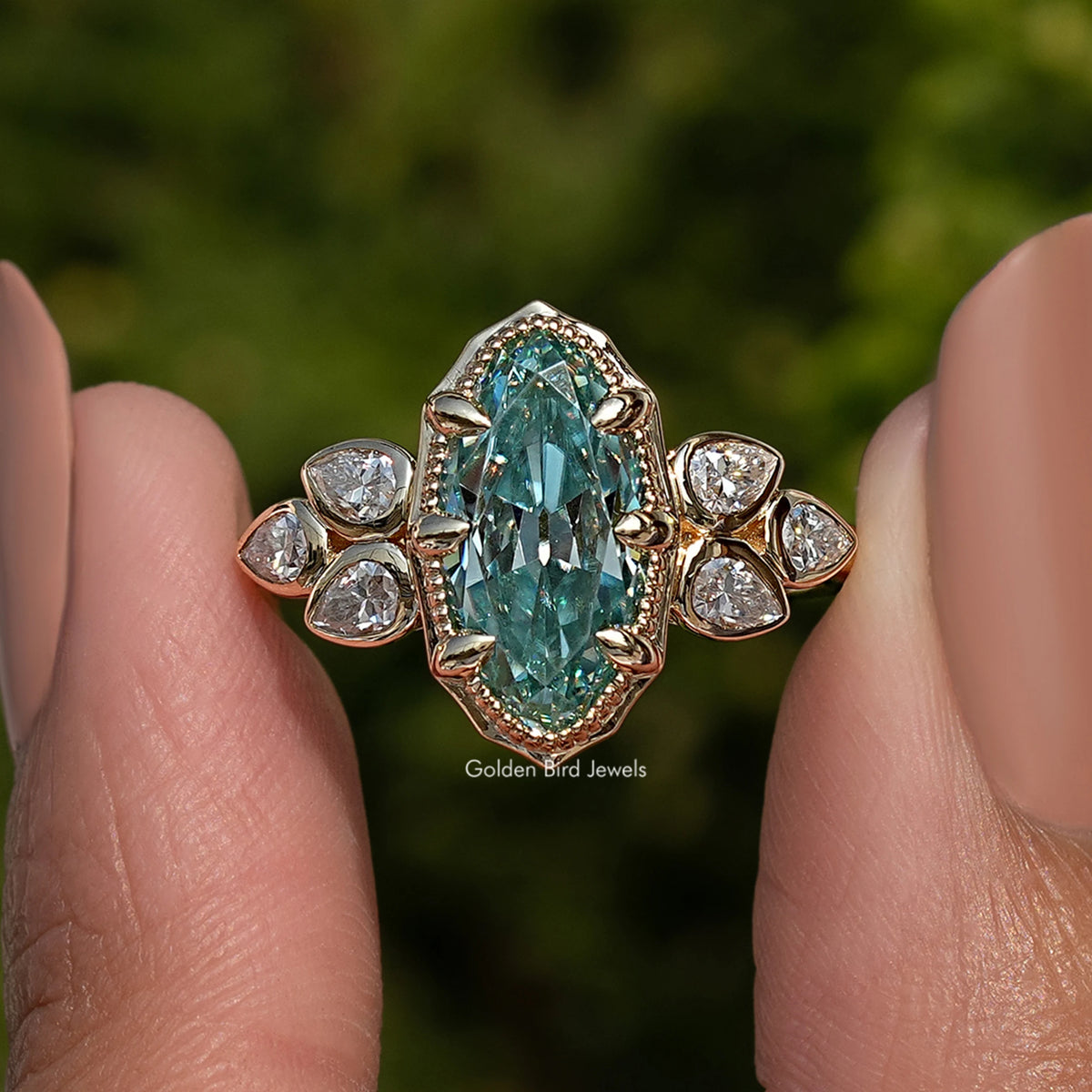 Blue oval moissanite ring with round side stones and ornate halo, close-up