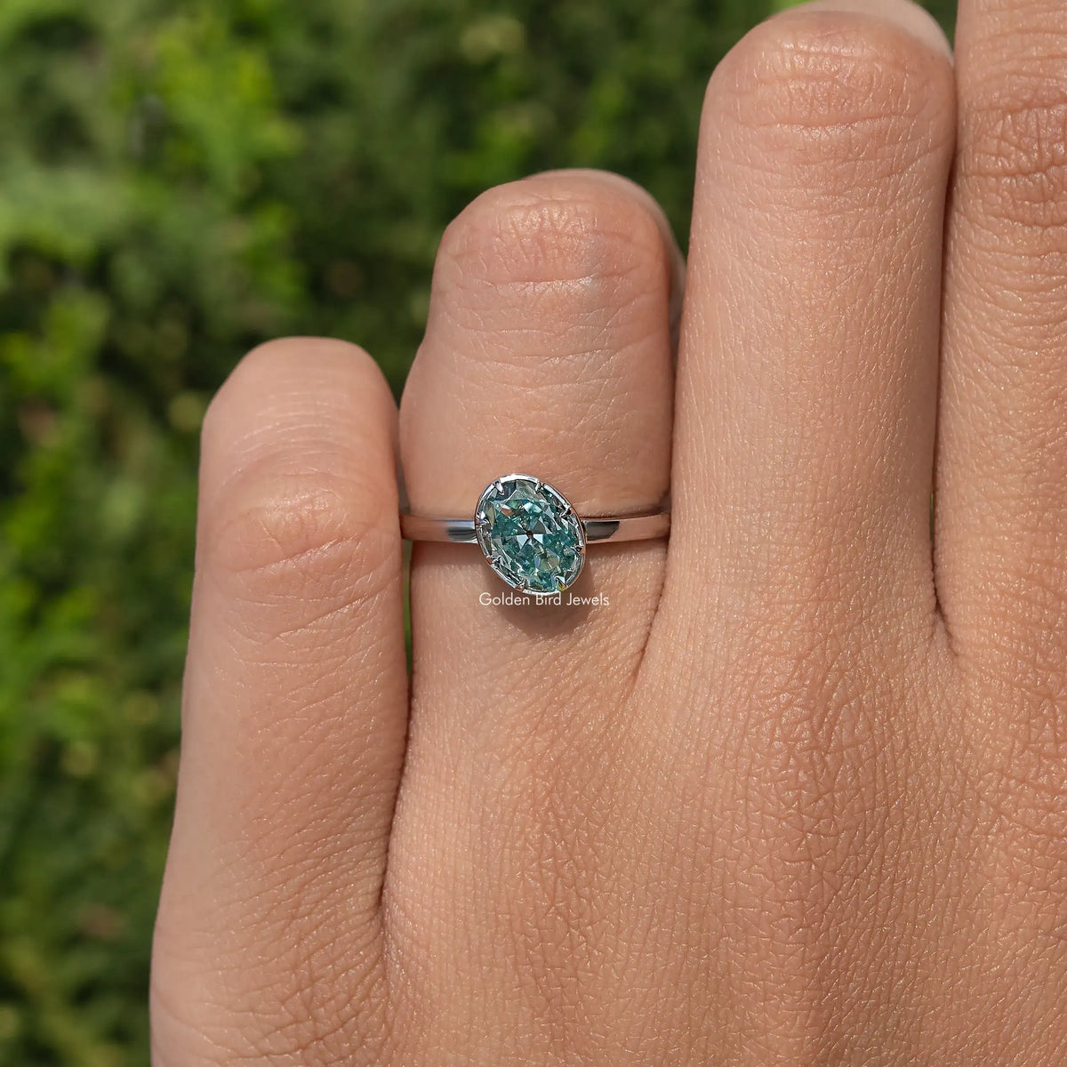 Oval blue moissanite solitaire ring with slim 925 sterling silver band