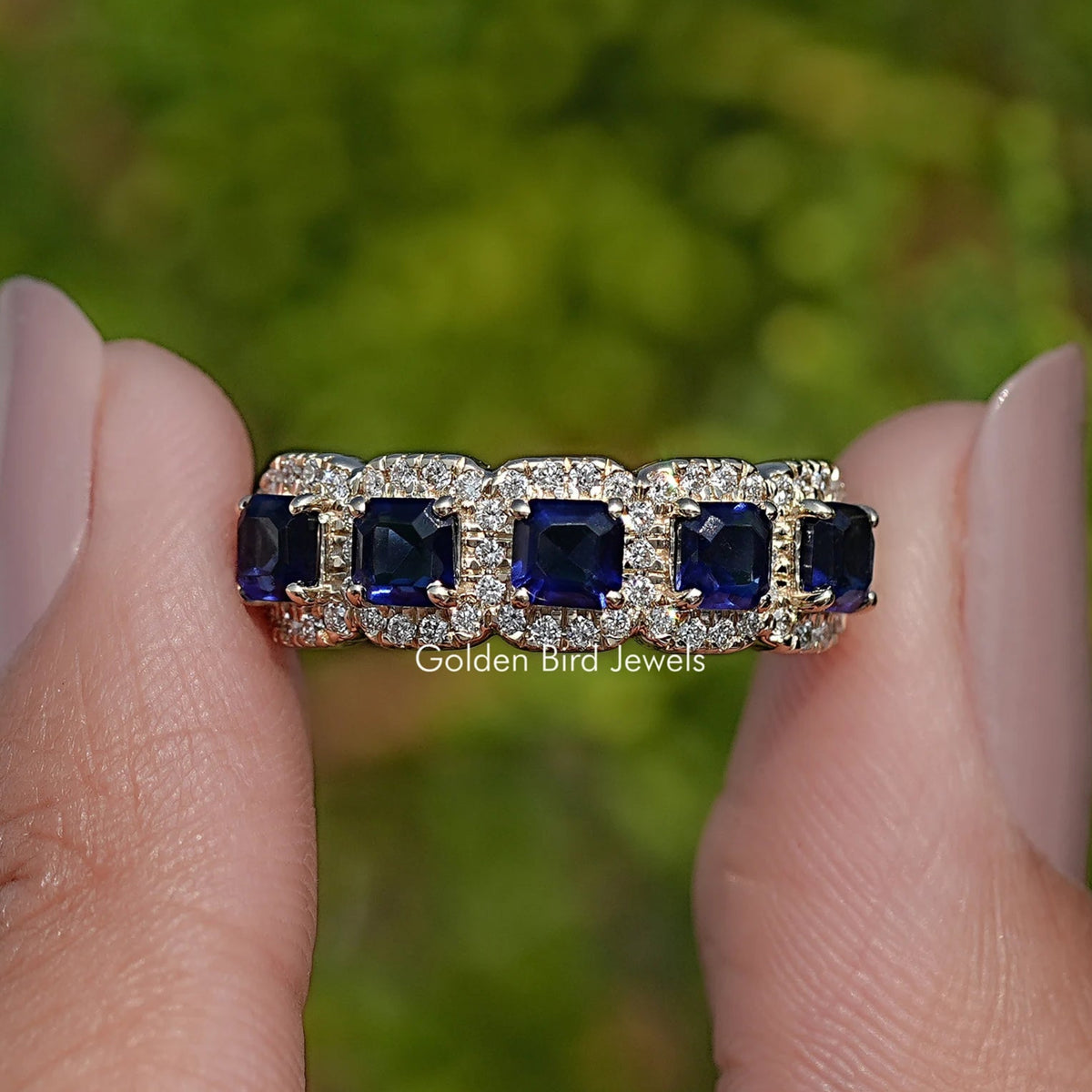 Blue Asscher gemstone five-stone halo ring with square blue stones