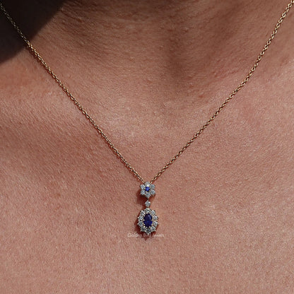 Front view of Blue Sapphire Oval Gemstone Halo Pendant In Women's 