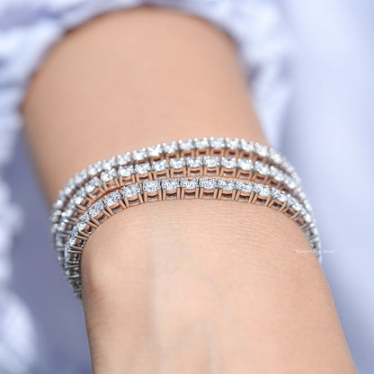 Silver tennis bracelet with round-cut lab diamonds, full top view on wrist