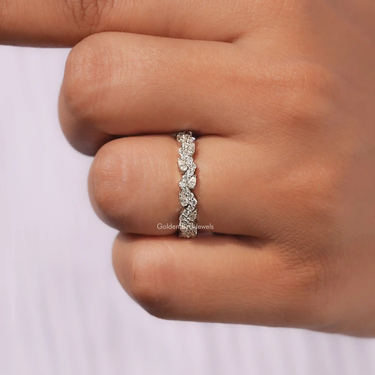 View of Pear Shaped Solitaire Moissanite Ring in prongs setting