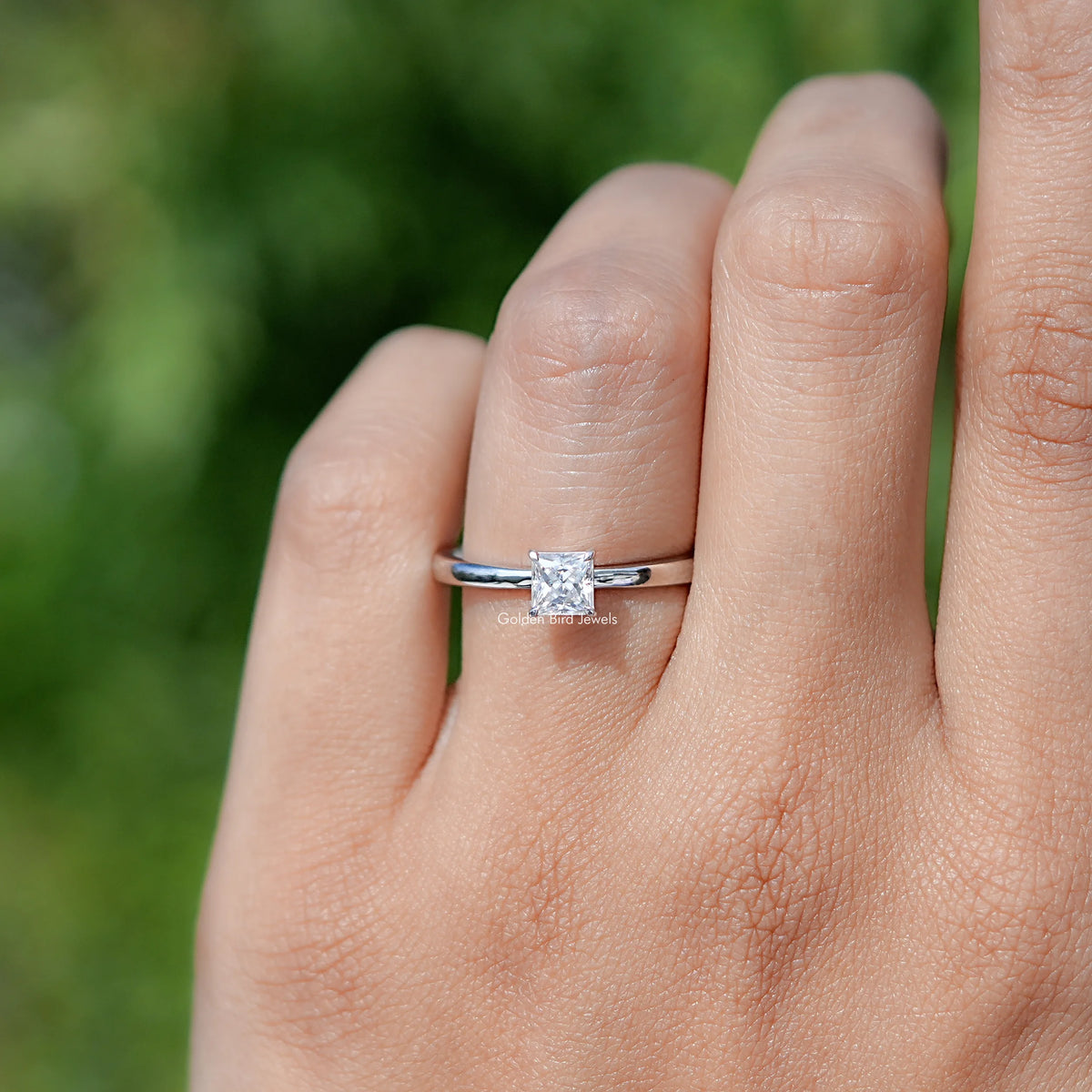 In finger front view of Princess Cut Moissanite engagement ring 