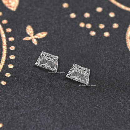 Trapezoid-cut lab diamond stud pair, angled close-up