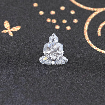 Lab-grown diamond on prongs, triangular cluster cut with faceted sparkle