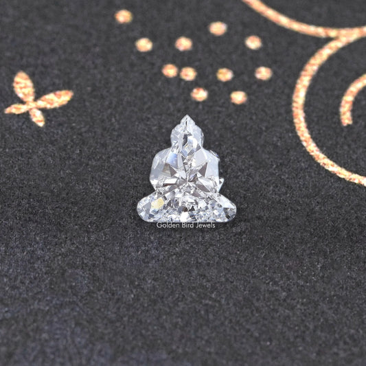 Lab-grown diamond on prongs, triangular cluster cut with faceted sparkle