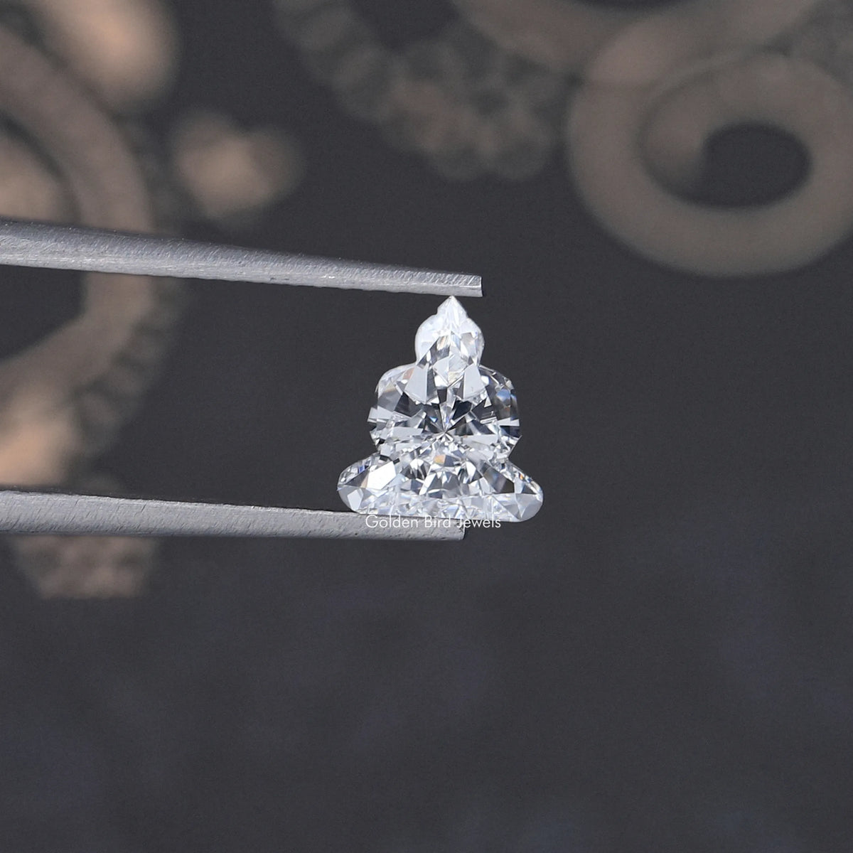 Lab-grown diamond on metal prongs, triangular cluster cut with bright facets