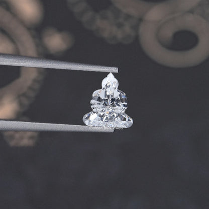 Lab-grown diamond on metal prongs, triangular cluster cut with bright facets