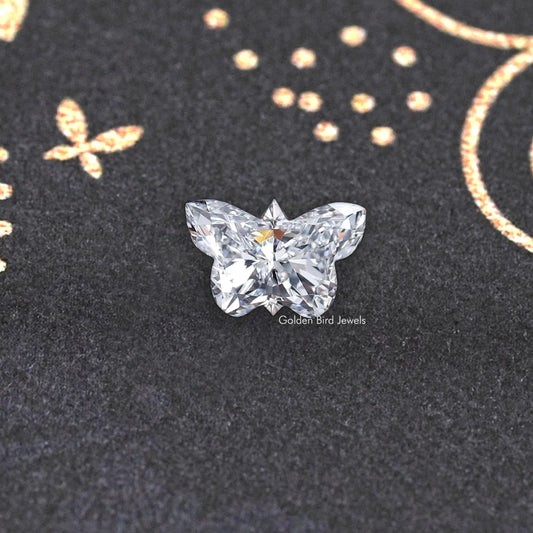 Butterfly-cut lab-grown diamond with clear facets, star center, polished