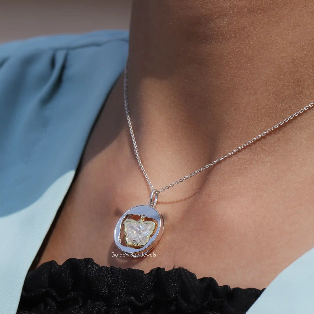 Side view of bezel set pendant In white Gold