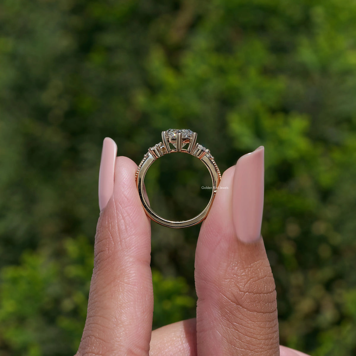 Marquise-cut lab-grown accent ring with halo and prong-set side stones
