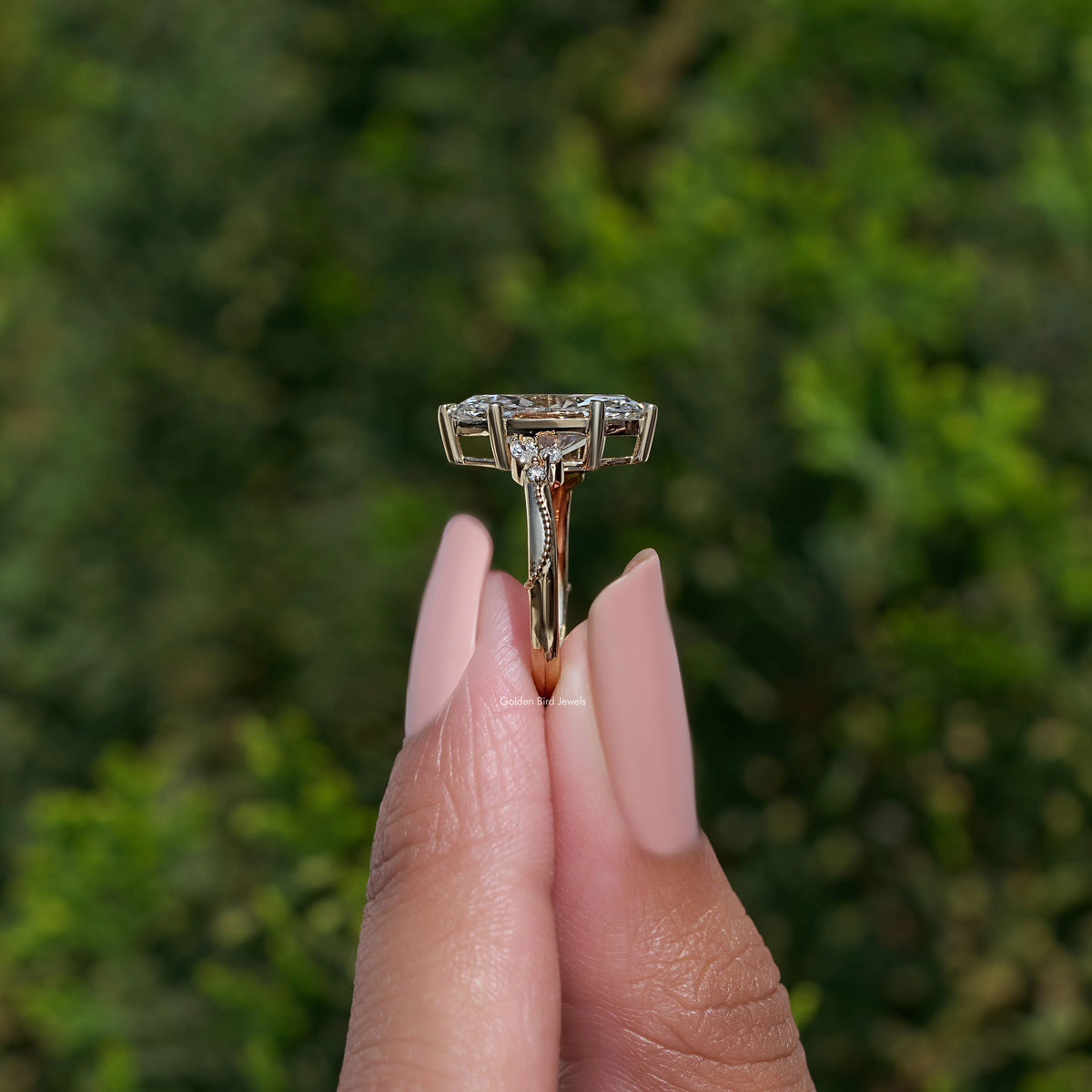 Marquise-cut ring with open bypass shank and rectangular side accents