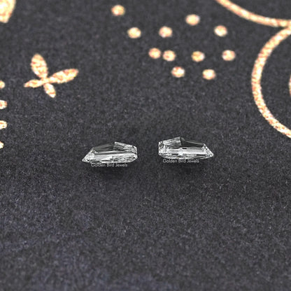 Cadillac-shaped lab-grown loose diamonds pair, clear step-cut facets, side view