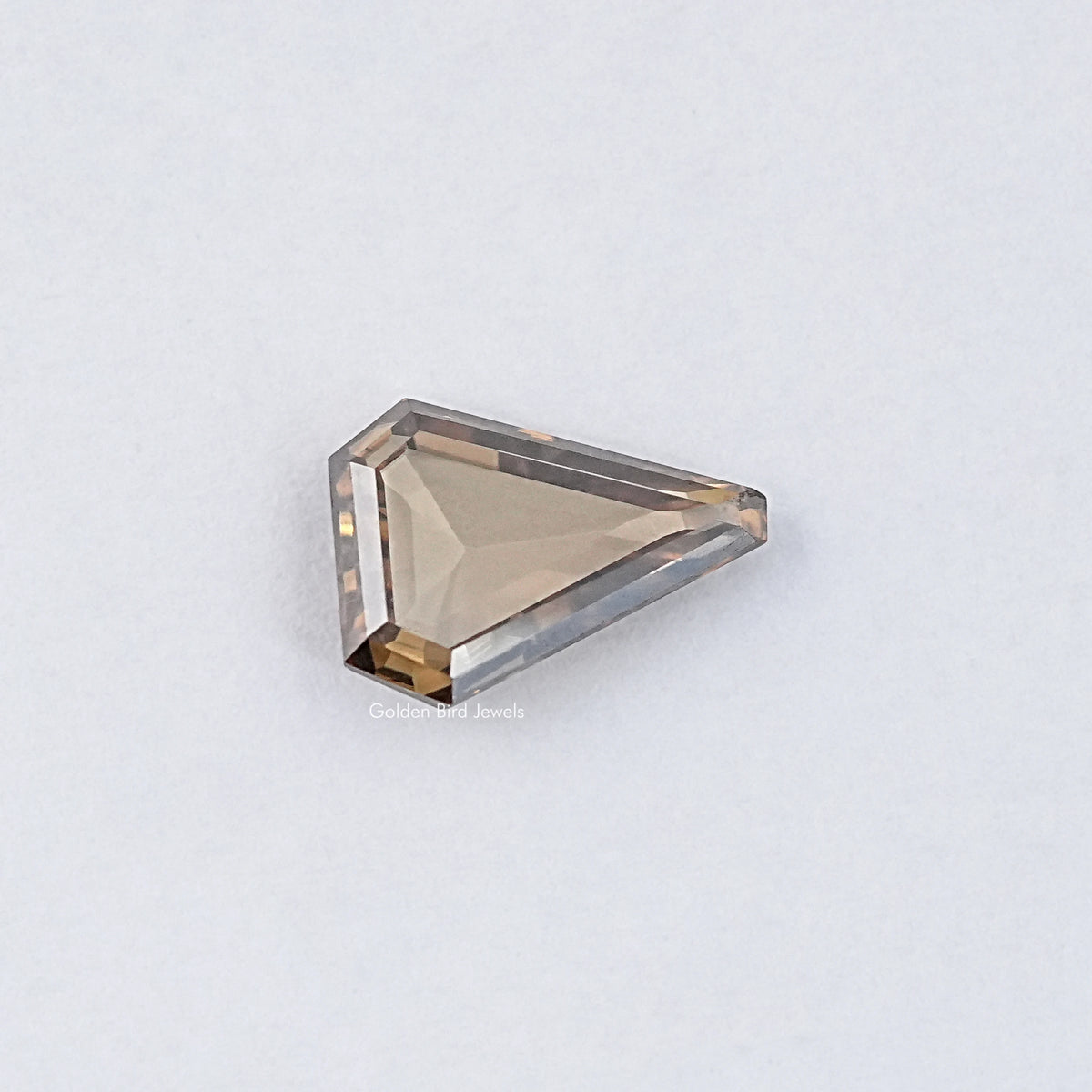 Loose moissanite stone, golden rectangular step-cut with visible side facets