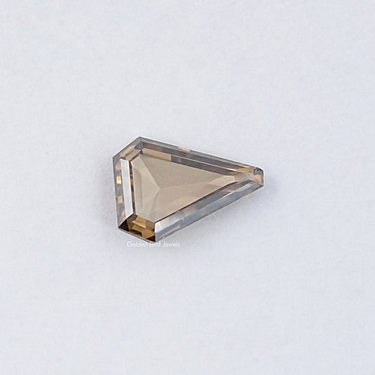 Loose moissanite stone, golden rectangular step-cut with visible side facets