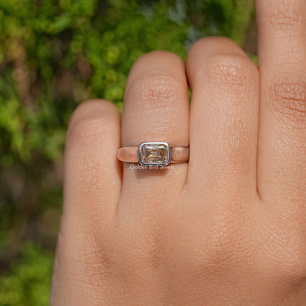 Champagne moissanite solitaire ring with criss-cut rectangular center stone, silver band