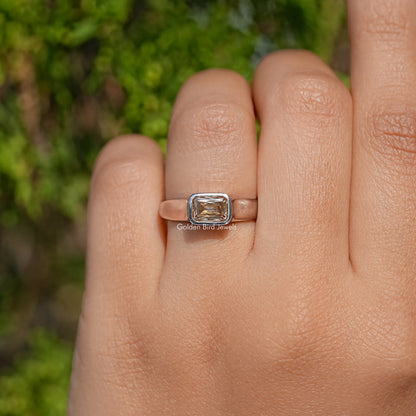 Champagne moissanite solitaire ring with criss-cut rectangular center stone, silver band