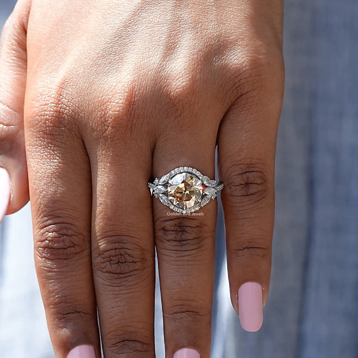 Silver halo cluster ring with round champagne center stone, detailed band view