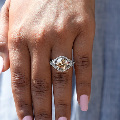 Silver halo cluster ring with round champagne center stone, detailed band view