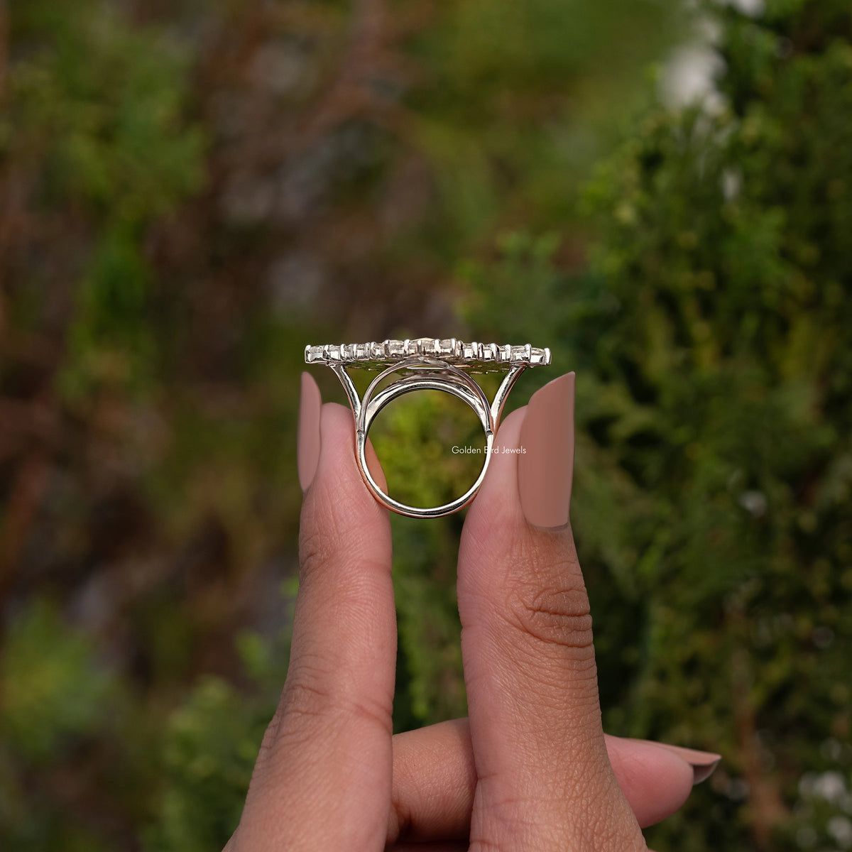Vintage moissanite ring with marquise-cut center and oval halo, prong set