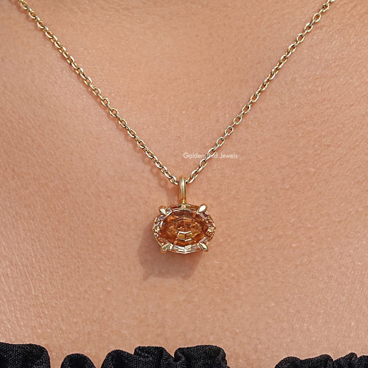 Champagne oval moissanite pendant on gold chain, macro close-up