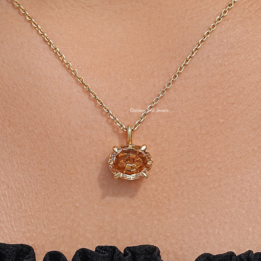 Champagne oval moissanite pendant on gold chain, macro close-up