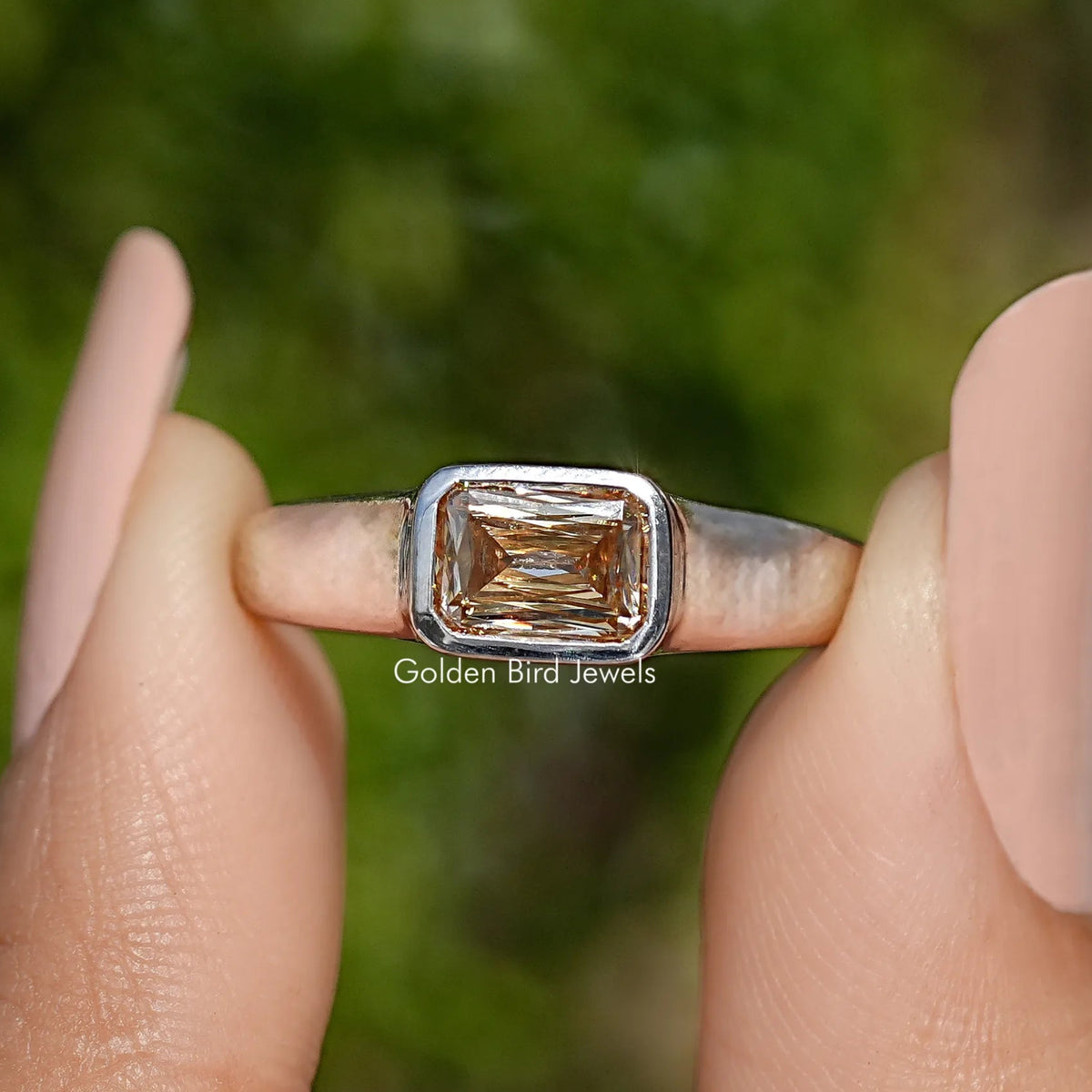 Sterling silver solitaire ring with square champagne moissanite, close-up front view