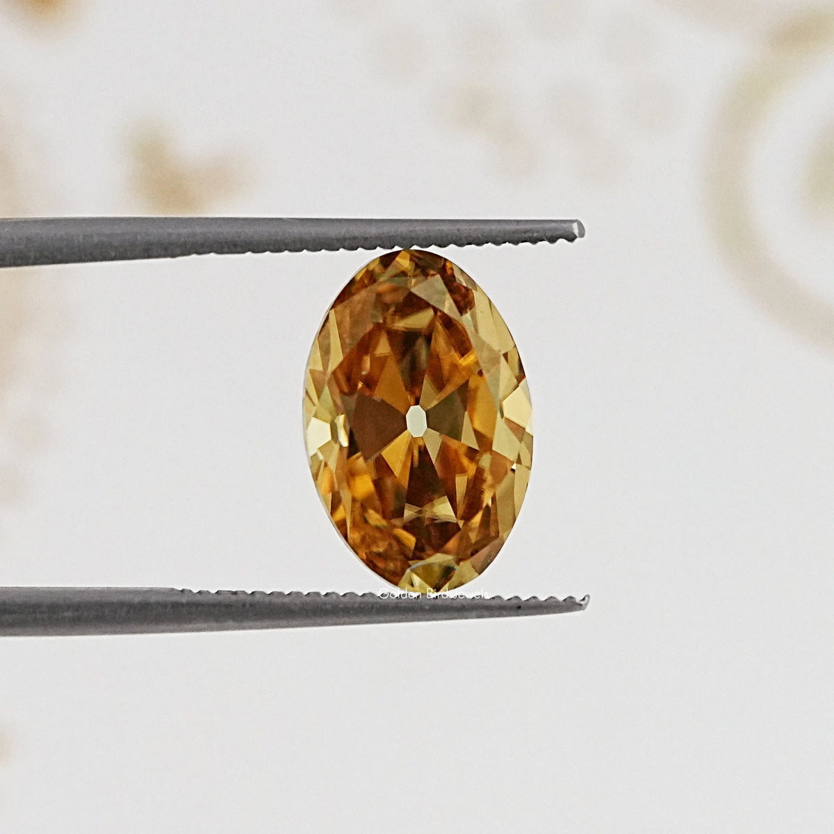In Tweezer View Of Old Mine Oval Cut Loose Moissanite Stone