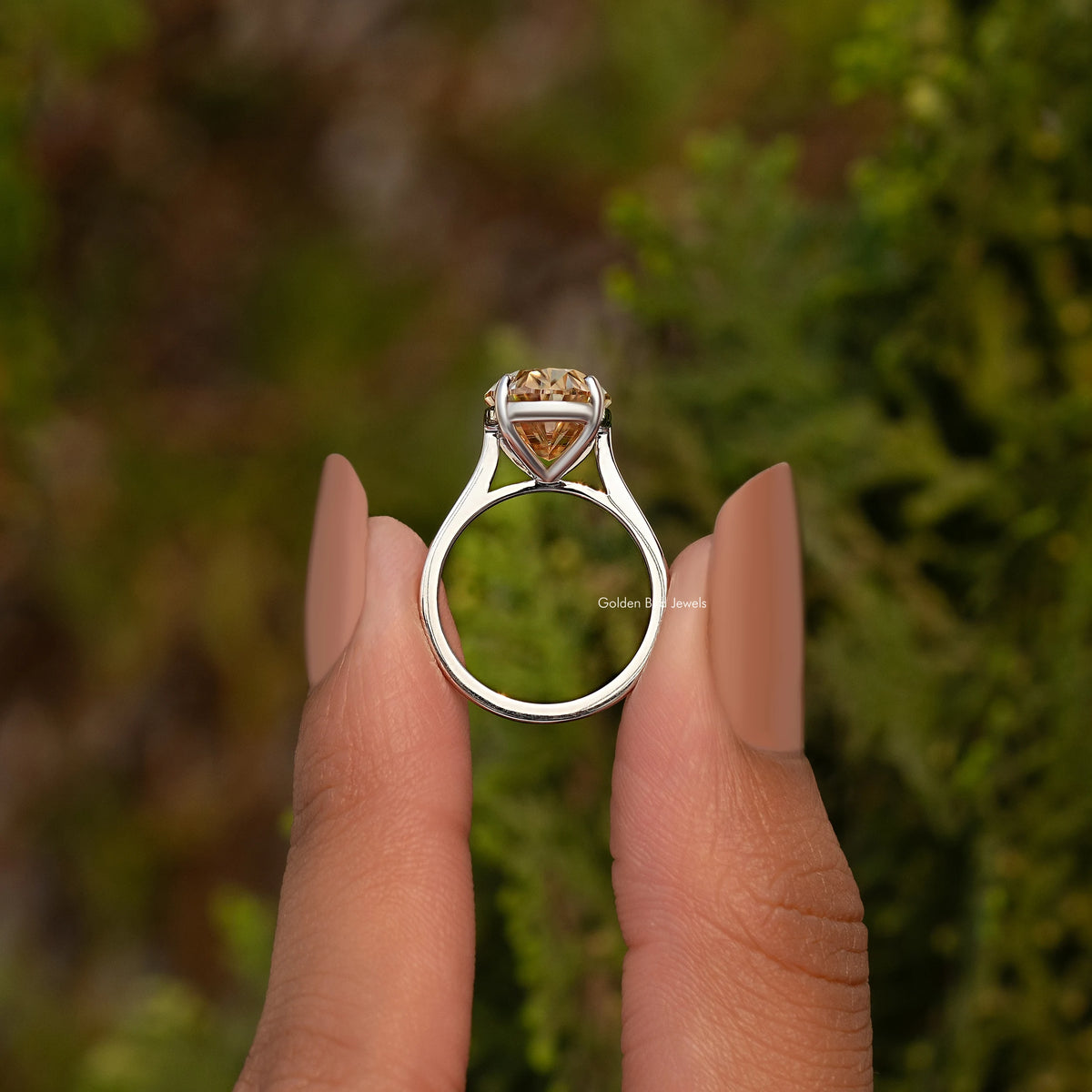 Oval champagne moissanite ring with sterling silver band and cathedral-style setting