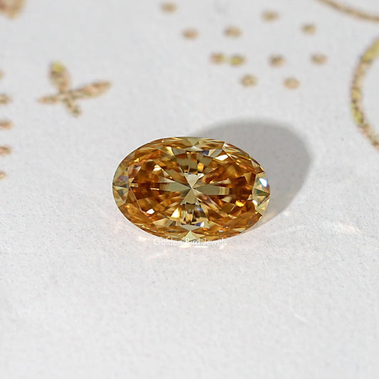 Oval champagne moissanite loose stone with strong golden facet reflections