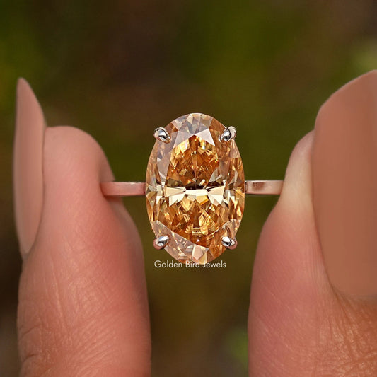 Oval champagne moissanite ring with sterling silver band and prong setting