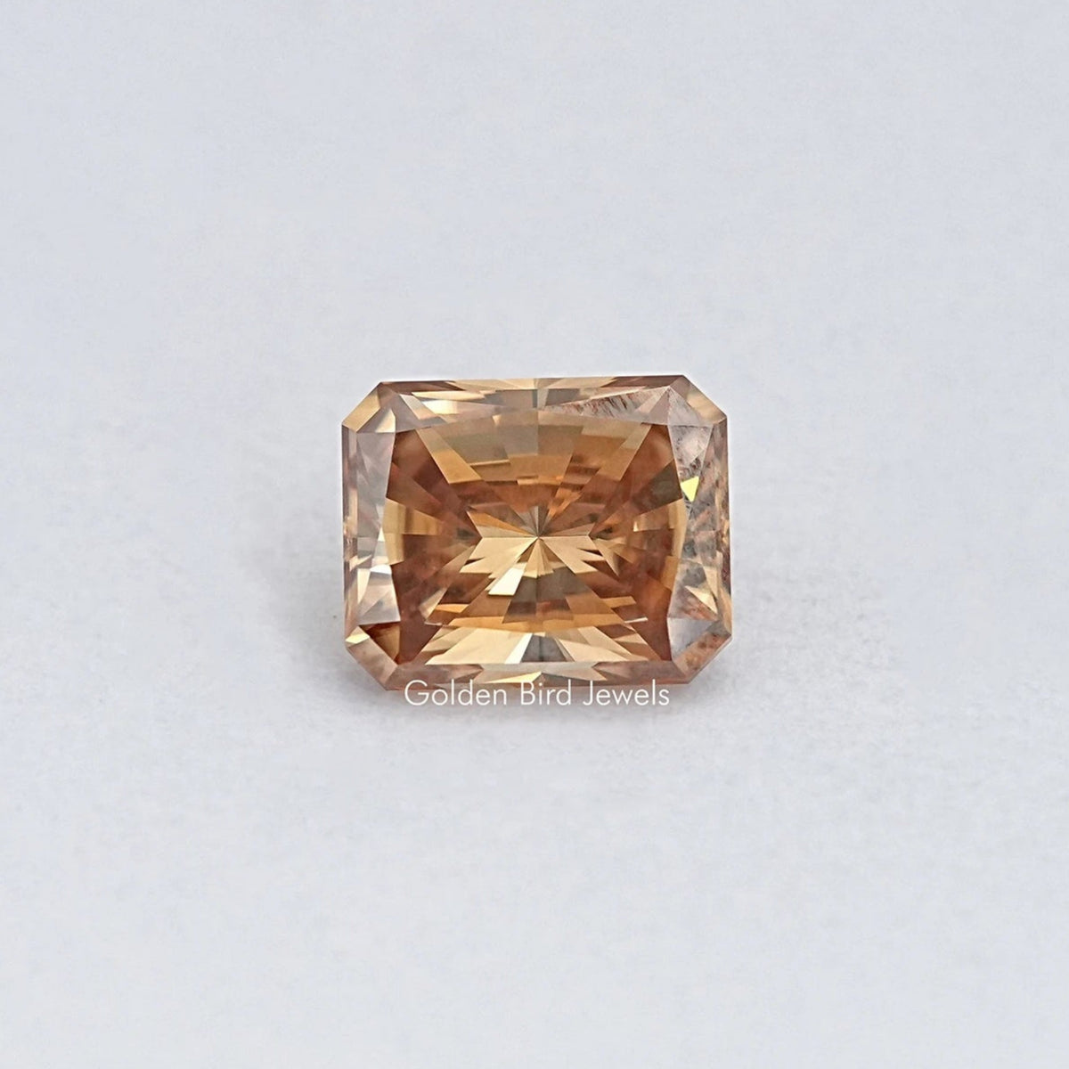 Champagne moissanite loose stone, emerald-cut with warm golden-brown sparkle