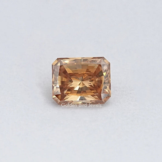 Champagne moissanite loose stone, emerald-cut with warm golden-brown sparkle